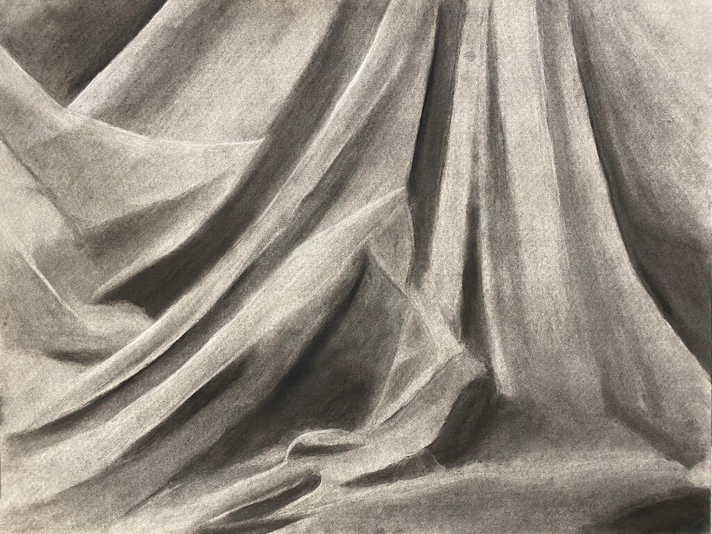 Fabric A charcoal drawing of flowing fabric.